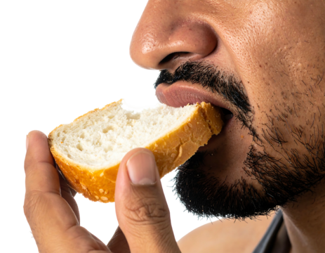 Close-up of a person eating a slice of white bread, focusing on the mouth, nose, and hand holding the bread