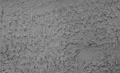 Gray rough uneven concrete wall.