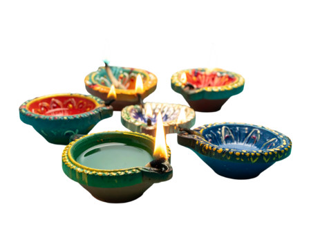Array of lit, colorful diya lamps sit, close-up, against a dark background, conveying festivity and warmth - Powered by Adobe