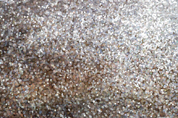 Close up of tiny silver and brown glitter particles