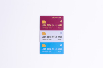 Three Fictional Cards Stacked Vertically on White. Blue, white, and red options for secure online payment and modern banking services.
