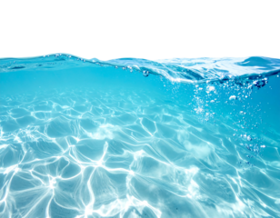 Crystal blue water refracts light on the sandy seabed, with air bubbles rising