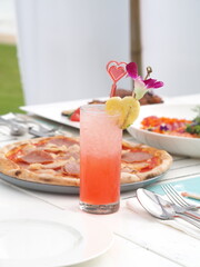 Fruit Punch Drink with Heart-Shaped Pineapple Garnish at a Beach Resort in Thailand
