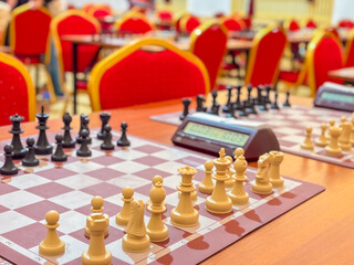 Chess tournament hall with red chairs © Lana Pietukhova