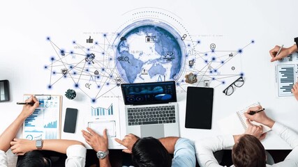 A diverse group works together in a modern workspace, utilizing technology to analyze data while discussing digital marketing strategies and exploring global connections. Raster - Powered by Adobe