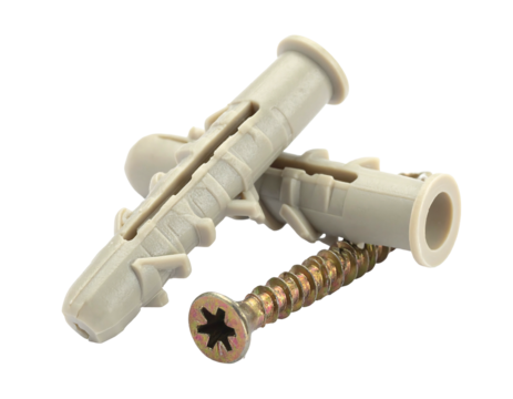 Close-up of two plastic anchors and a screw, all resting on a black background