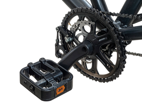 Close-up shot of a black bicycle crankset, pedal, and chain on a black background