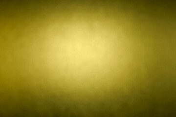 黄色の柔らかな光が広がる抽象的な背景