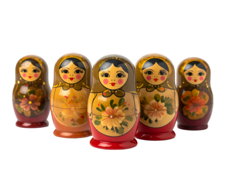Collection of traditional, wooden, painted nesting dolls with floral designs against a dark background, arranged in a row