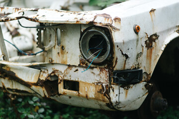 Headlight of an Abandoned White Car