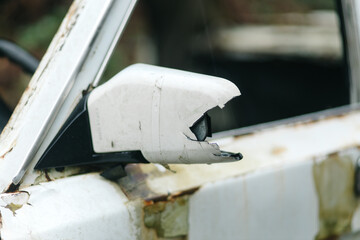 Broken Mirror of an Abandoned Car