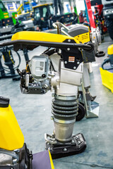 Close-up of a vibratory rammer (jumping jack compactor) for soil and asphalt compaction. Essential heavy machinery for civil engineering and road cons