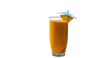 A refreshing tropical smoothie in a colorful glass, with a pineapple slice and paper umbrella, placed on sand with the ocean and islands behind.