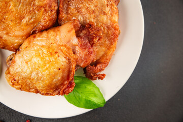 Chicken thighs fried poultry meat dish natural product tasty snack fresh delicious gourmet food background on the table rustic top view copy space