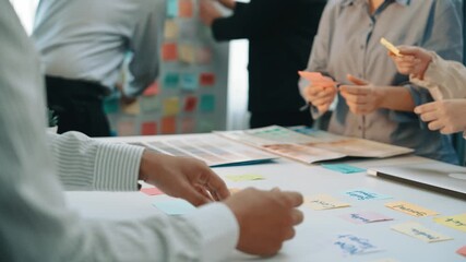 A bright office scene capturing a collaborative brainstorming session where diverse team members actively share ideas and feedback through colorful notes and creative discussion. SACTR