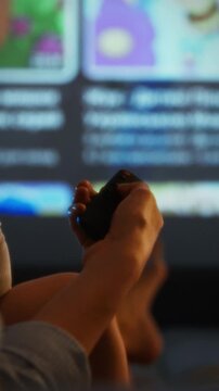 Kids gather for a family movie night in a cozy living room, watching animated films on a projector. Laughter and excitement fill the air as they enjoy the experience together