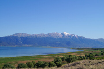 Peaceful lakeside scenery with calm waters along the shore of Lake Eğirdir.