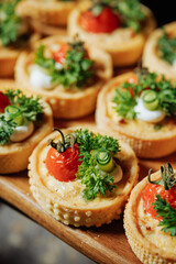 Mini vegetable tartlets with herbs close-up