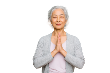 full body portrait of an elderly Asian woman with gray hair practicing yoga namaste pose on white background, calm smile, healthy aging concept, minimalist clean background, studio lighting, realistic