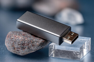 USB flash drive with blank metal shell on clear acrylic block and gradient background
