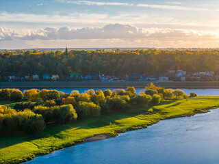 Kaunas old town and modern new city center in autumn, Lithuania. Aerial drone view on golden hour