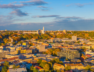 Obraz premium Kaunas old town and modern new city center in autumn, Lithuania. Aerial drone view on golden hour