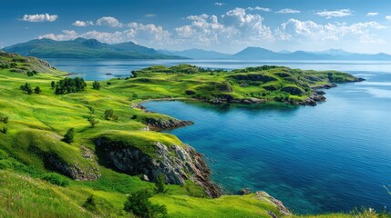 Fototapeta premium Stunning panoramic view of a serene landscape featuring lush green hills, sparkling blue water, and distant mountains under a bright blue sky with fluffy clouds