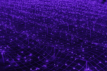 Abstract futuristic background of purple LED lights arranged in grid pattern, network, glowing in dark night atmosphere. Bokeh textured backdrop shining on dark, festive holiday texture for design.