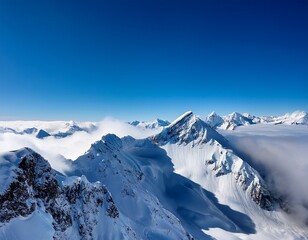 Fototapeta premium majestic snowy mountain peaks rising above clouds under a bright blue sky