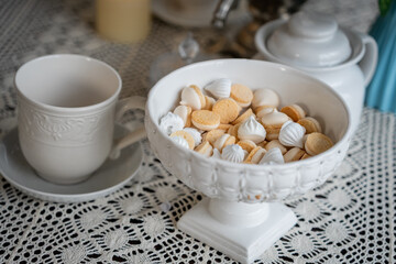 Elegant Dessert Table with Meringues and Tea Setup