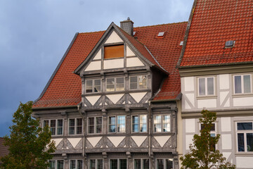 Old city of Wolfenbüttel, Lower Saxony, Germany in autumn, completely covered with a thick carpet of fallen leaves in vibrant shades of yellow, orange, and brown.