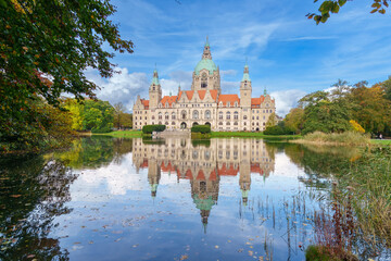 New City Hall of Hannover reflecting in water in the autumn, Hanover Maschpark, Lower Saxony, Germany. High resolution photo, desktop wallpaper