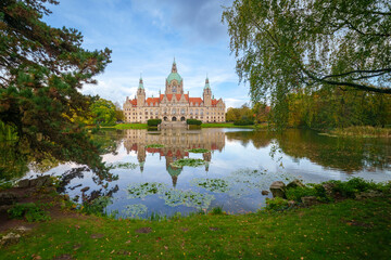New City Hall of Hannover reflecting in water in the autumn, Hanover Maschpark, Lower Saxony, Germany. High resolution photo, desktop wallpaper