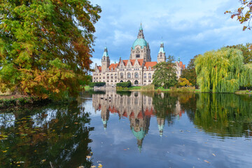New City Hall of Hannover reflecting in water in the autumn, Hanover Maschpark, Lower Saxony, Germany. High resolution photo, desktop wallpaper