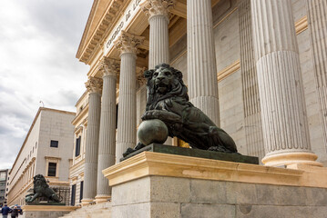 Statue of lion at Palace of Parliament (Congress of Deputies) in Madrid, Spain