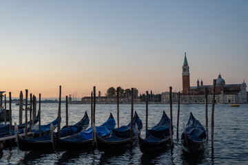 Venice – Sunrise over Canal with Docked Gondolas