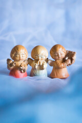 Guardian angel - wooden angels on a blue background	