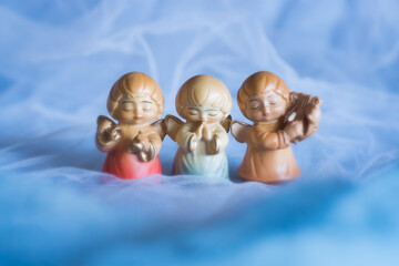 Guardian angel - wooden angels on a blue background	
