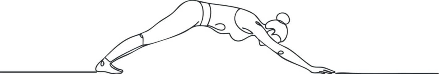 A woman performing downward dog pose in yoga showcasing flexibility and strength through movement.