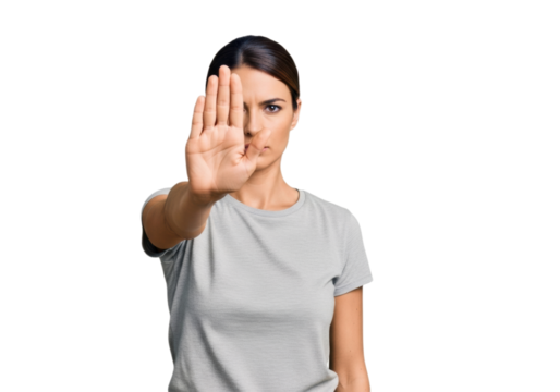 Young woman showing a ''stop'' gesture with her hand, on a transparent background, isolated