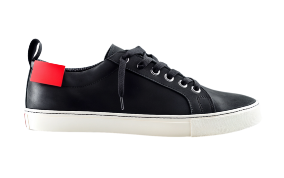 Trendy black sneakers displayed with a red sale sticker highlighting modern urban fashion footwear isolated on transparent background PNG