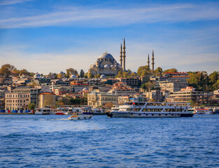 The Golden Horn with the Historic Peninsula skyline and Istanbul ferry, Turkey.