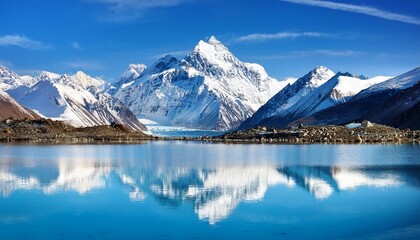 Obraz premium majestic snow capped mountains reflecting in a crystal clear glacial lake under a vibrant blue sky