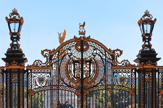 London, United Kingdom - August 11, 2022: Decorative iron gate detail at Buckingham Palace with gold ornaments