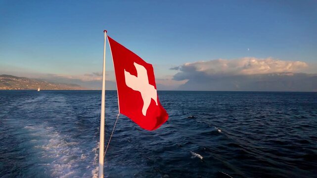 Real Time of 4K Swiss National Flag Waving Over Lake Geneva, Switzerland.