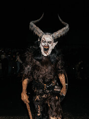 Noetsch, Austria - December 09, 2023: Krampuslauf Noetsch festival features a costumed figure of...