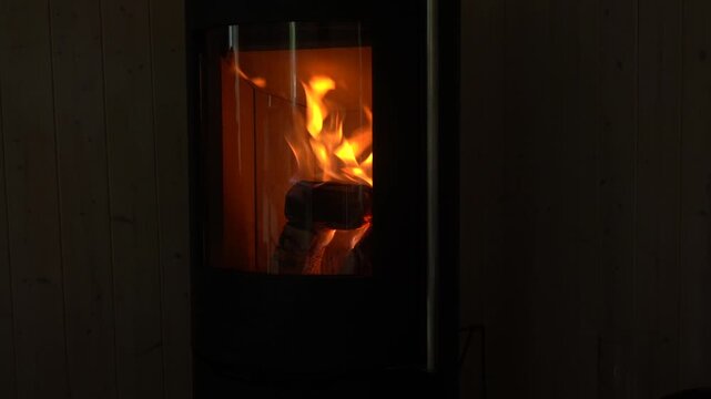 A fireplace with fire. A fire is burning in the fireplace. An atmosphere of coziness and warmth.