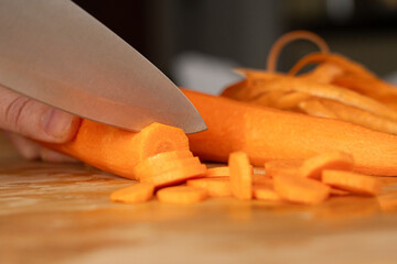Cutting Fresh Carrot with Knife Close Up, Raw Carrot Slices Closeup, Orange Root Vegetable