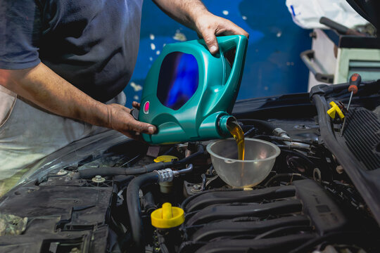auto mechanic working
It's time for vehicle maintenance at the service. Engine oil change