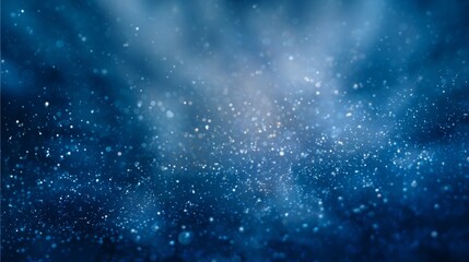Naklejka premium A Mesmerizing Blue Background with Emanating Light and Shimmering Particles, Perfect for Various Creative Uses and Designs